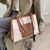 Sac avec lanière et poche latérale