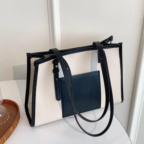 Sac avec lanière et poche latérale